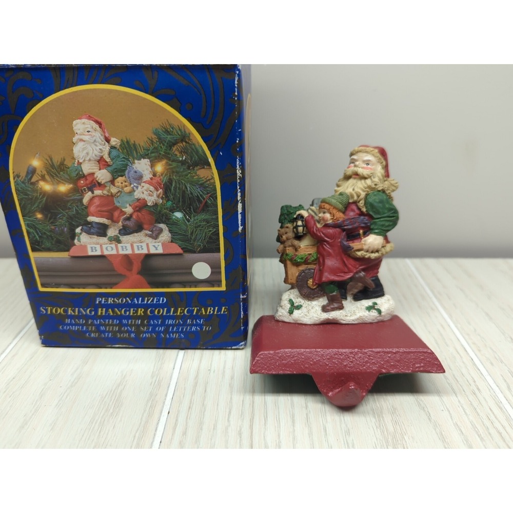 Studio Eluceo Cast Iron Resin Xmas Stocking Holder Santa Child Lantern Cart